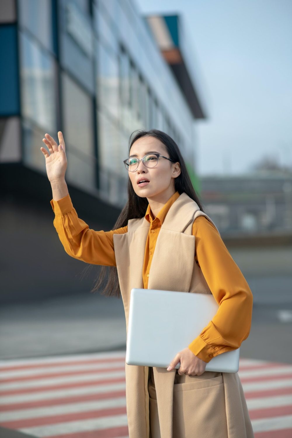 young-asian-pretty-woman-waving-her-hand-on-the-road.jpg young-asian-pretty-woman-waving-her-hand-on-the-road.jpg